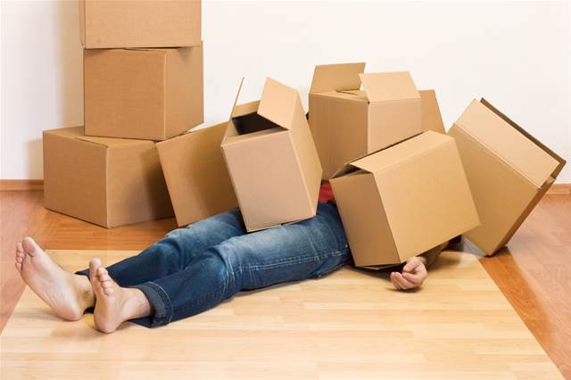 0_480_640_0_70_-News-moving-stress-man-covered-in-cardboard-boxes